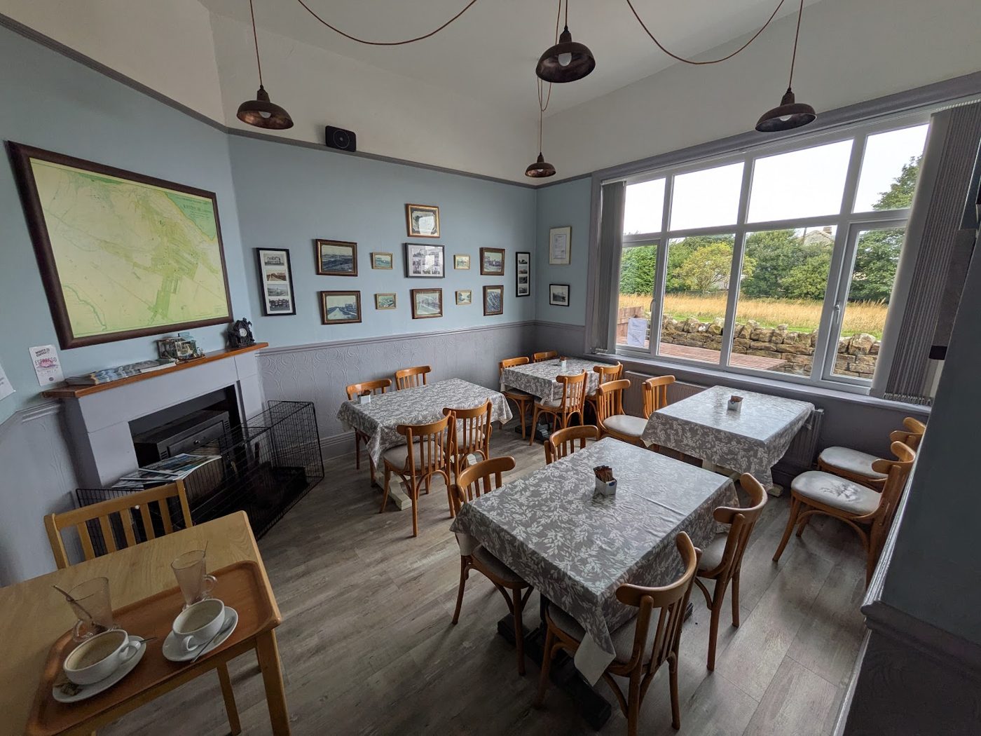 Inside Ravenscar Tearooms: tables by the big windows